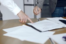 business-men-sitting-lawyers-s-desk-people-signing-important-documents.jpg