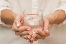 woman-holding-glass-filled-with-water.jpg