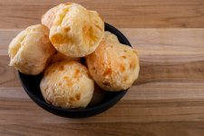 bowl-with-cheese-breads-wooden-table.jpg