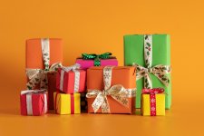 closeup-multi-colored-gift-boxes-orange-background-christmas-mood.jpg