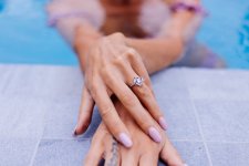 close-shot-womans-hands-edge-swimming-pool-with-ring-finger.jpg