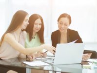 three-business-women-discussing-work-issues-office.jpg