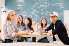 group-students-posing-table.jpg