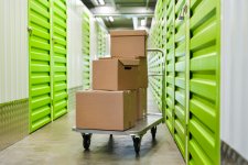 surface-image-cart-with-cardboard-boxes-empty-hall-self-storage-facility-copy-space.jpg