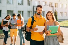 two-happy-students-with-backpacks-books-their-hands-smiling-camera (2).jpg