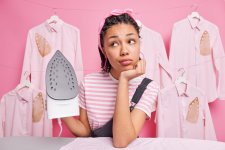 pensive-woman-leans-ironing-board-stands-with-daydreaming-expression.jpg