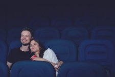 smiling-couple-embracing-watching-funny-movie-cinema.jpg