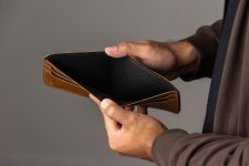 close-up-male-hand-open-empty-wallet-there-is-no-money-wallet-financial-business-concept.jpg